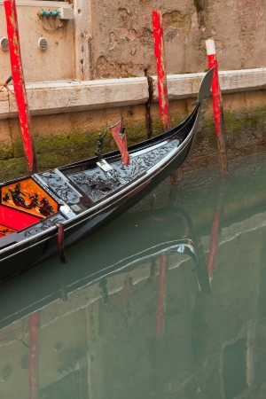 Venetian gondola boat in canal. Venice. Italy.の写真素材