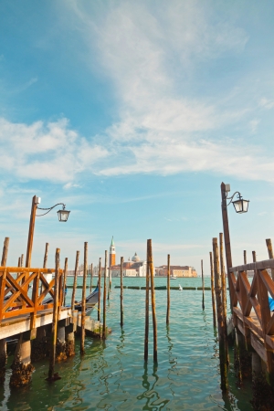 Pier for gondola boats at canal in Venice. Italy.の写真素材