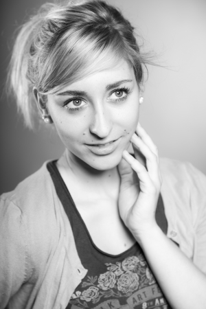 Fashion beauty studio portrait of pretty girl with long blonde hair. Black and white shot.の写真素材