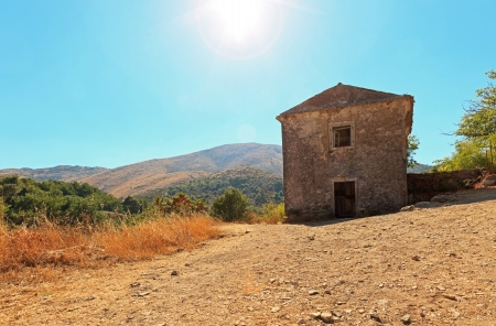 Panoramic shot of a lonely house in the oldest village of Corfu island  Blue sky  Old Perithia  Greece の写真素材