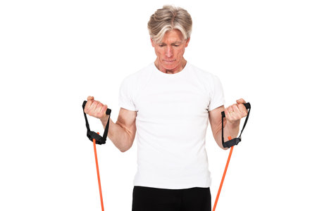 Senior fitness man exercising with orange elastics. Isolated on white.