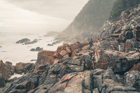 Female tourist hiking along the wild coast of Tsitsikamma National Park. Eastern Cape. South Africa.の写真素材