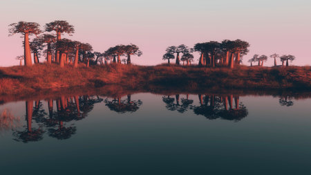 Colorful pink sunset over a tropical lake with trees on the bank lit by the last rays of the sun reflected in the still water belowの写真素材