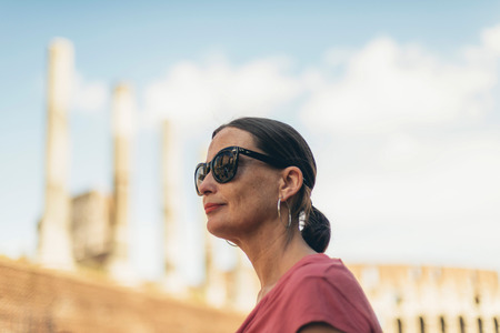 Female tourist with sunglasses admiring architecture of Rome.の写真素材