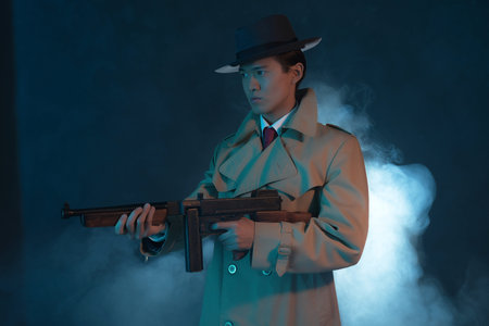 Vintage 1940 asian gangster fashion man in raincoat. Shooting with gun.