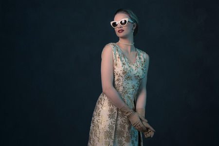 Chique vintage 50s fashion woman wearing sunglasses.の写真素材