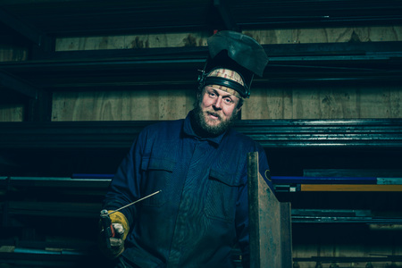 Portrait of welder with beard in workplaceの写真素材