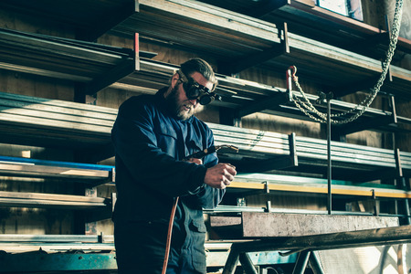 Man lighting soldering deviceの写真素材