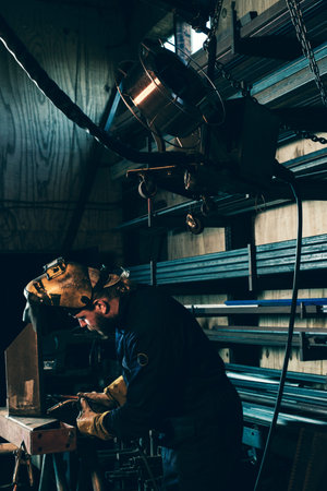 Welding device hanging in workplace