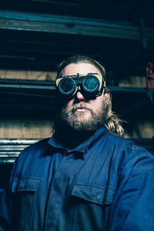 Portrait of bearded welder with safety glassesの写真素材