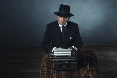 Vintage 1940 office worker behind desk with typewriter and telephone.