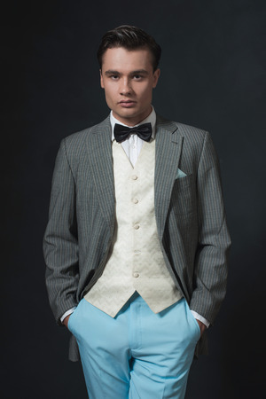 Retro 1920s business man in suit with bow tie.の写真素材