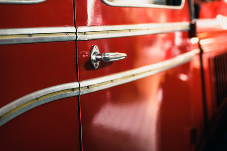 Close-up of door handle of old fire truck.の写真素材