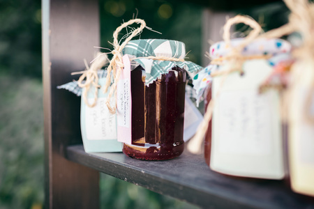 Private stall with home-made jams standing outdoors in summer.の写真素材