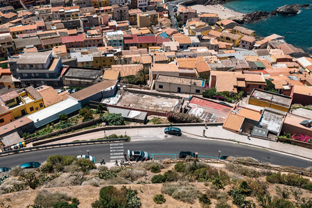 High angle view of old italian town with traffic on road. Sardinia. Italy.の写真素材