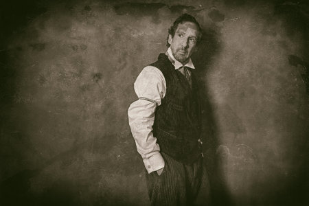 Classic wet plate photo of vintage 1900 western man leaning against wall.