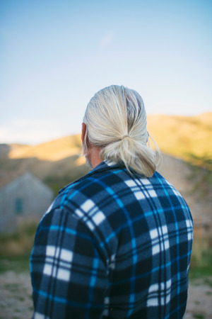 Rear view of man with grey hair and beard in Old Perithia, Corfu, Greece.の写真素材