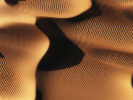 Aerial of sand dunes in low sunlight.の写真素材