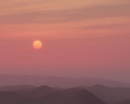 Mountains in mist at sunset.
