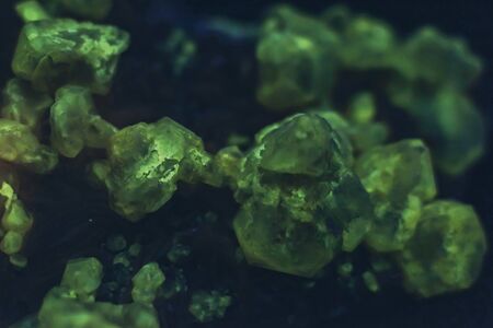 Detail of green fluorescent mineral stone.の写真素材