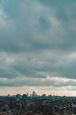 Old centre of the city of Amsterdam under cloudy sky in autumn. High angle view.の写真素材