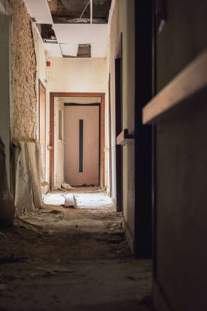 Dilapidated dirty hallway in an abandoned care home.の写真素材
