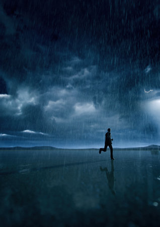 Man in black suit runs in rainy desert with a cloudy sky. 3D render.の写真素材