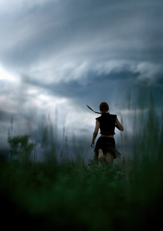 Woman with ponytail in black skirt and shirt runs barefeet through a field with tall grass under a dark cloudy sky. 3D render.の写真素材