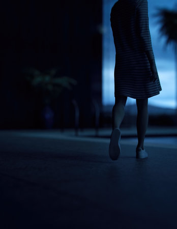 Woman in sweater dress walks to a pool on a terrace of a house. Rear view. 3D render.の写真素材