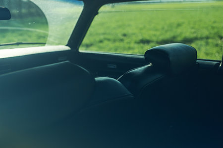 Interior of a vintage american muscle car seen through the drivers side window.の写真素材