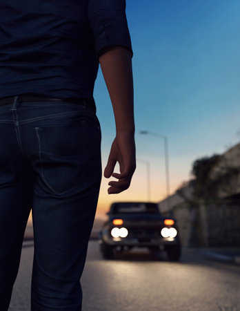 Man stands on road with a car with illuminated headlights during twilight. 3D rendering.の写真素材