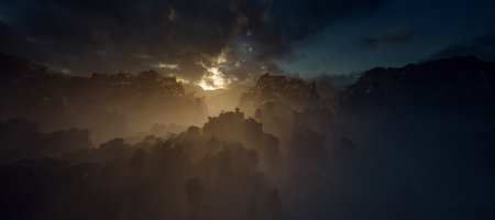 Misty jungle with rock pillars with cloudy sky at sunset.