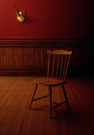 Vintage rustic interior with wooden chair, wooden floor, paneling, deer skull on the wall.の写真素材