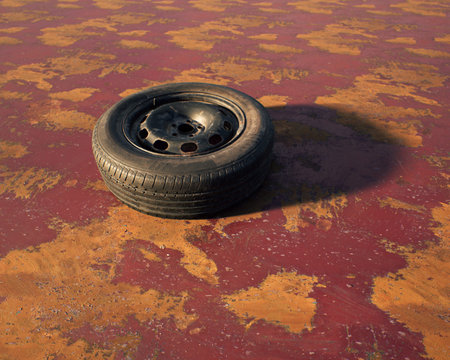 Old car wheel on weathered rusty red painted metal sheet.