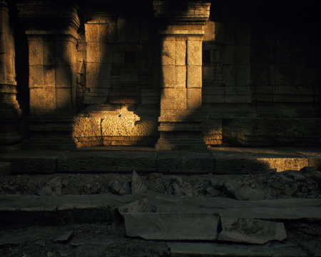 Ruins of an ancient temple lit by dappled sunlight in forest. 3D rendering.の写真素材