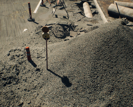 Roadside construction area in sunlight during a sunny day. High-angle view. 3D rendering.の写真素材