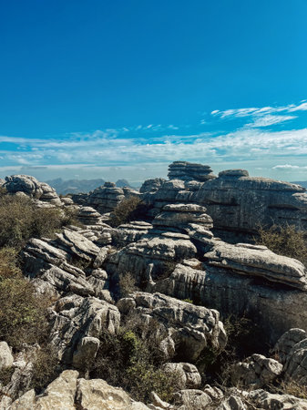 Majestic rock formations of limestone under blue sky with little clouds. National park of El Torcal de Antequera. Andalucia, Spain.の写真素材