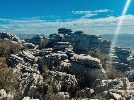 Majestic rock formations of limestone under blue sky with little clouds. National park of El Torcal...