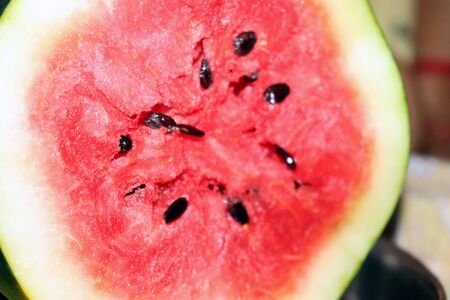watermelon and black seeds half cutの写真素材