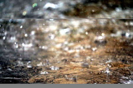 Dripping water on surface in the rainの写真素材