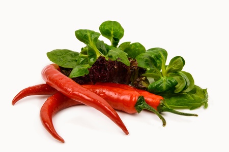 vegetables, three chili and green salad with arugula on a white backgroundの写真素材