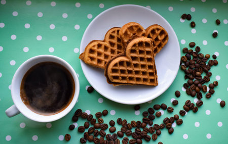 a cup of coffee on the table top view,cookies in the form of a heart,coffee beans