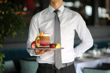 Waiter tray presentation with cocktailの写真素材