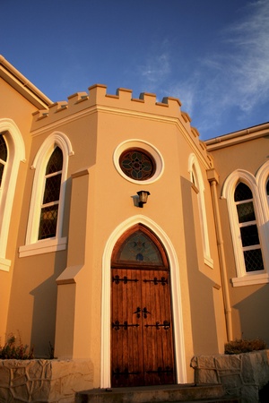 Arched church door against blue skyの写真素材