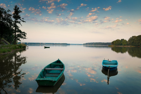 Rowing boats floating over the Lake Elk waters. Masuria, Poland.の写真素材