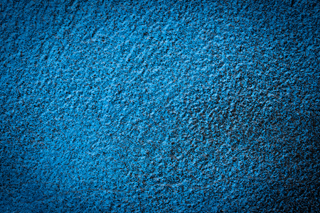 Texture of  blue spotted paint on the black tar.の写真素材