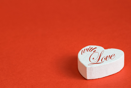 Wooden, white heart with inscription. Valentine's day background.の写真素材