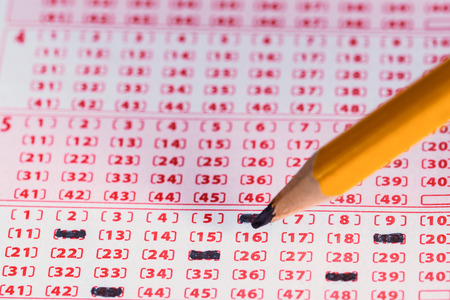 Marking number on lottery ticket with pencil.の写真素材