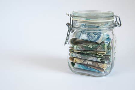 Money stored in a sealed retro  jar.の写真素材