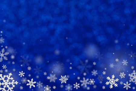 Christmas decoration with snowflakes on defocused blue background.の写真素材